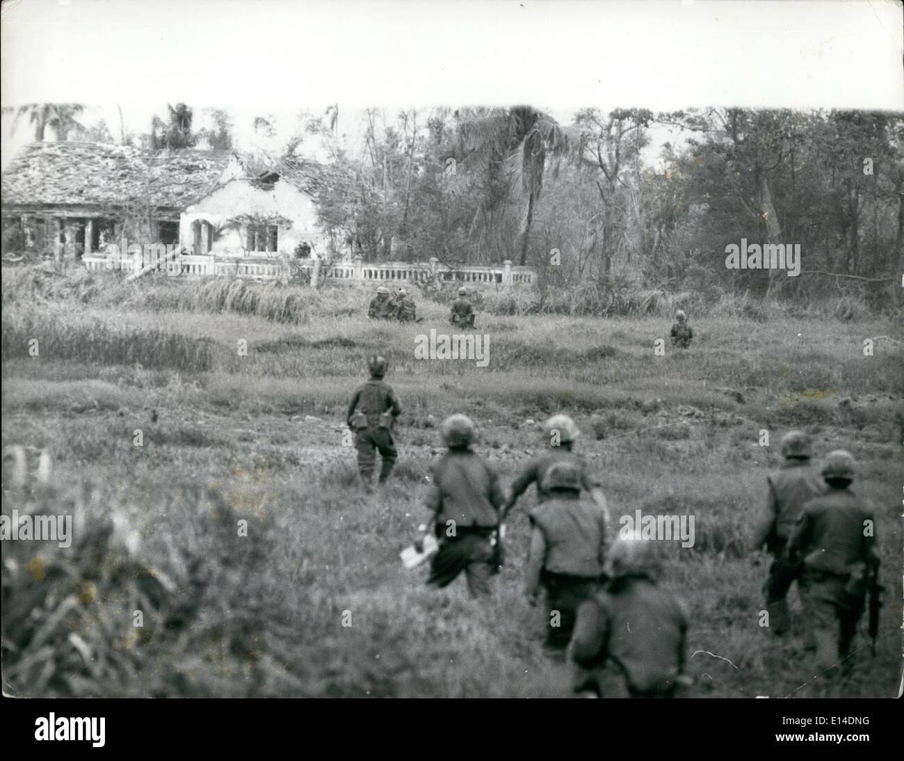 Apr. 18, 2012 - The Rok Tiger Division advance towards one of the houses they have destroyed in the Thanh Mai area of Vietnam. Stock Photo