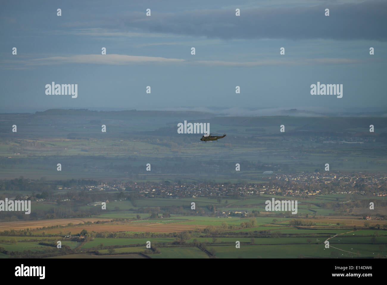 An aerial photograph showing a Sea King over North Somerset Stock Photo