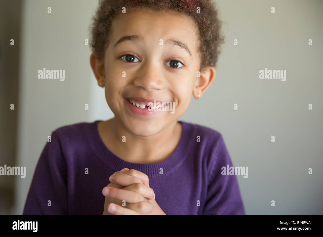 Girl with folded hands hi-res stock photography and images - Alamy