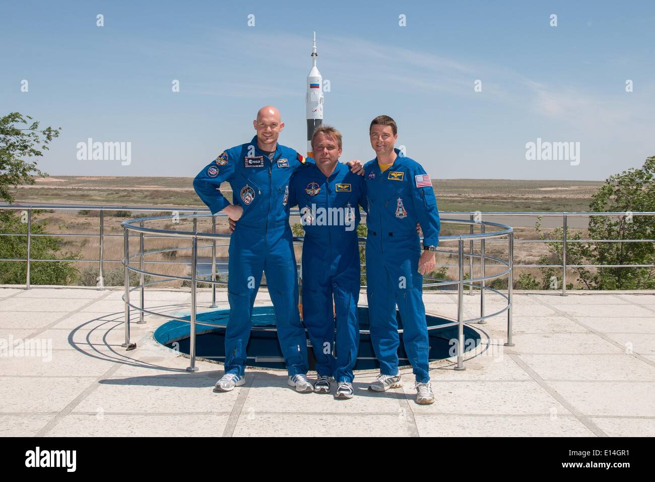 ISS Expedition 41 crews members stand for a group photo during pre-launch training May 21, 2014 in Baikonur, Kazakhstan. From left to right are Alexander Gerst of the European Space Agency , Soyuz Commander Max Suraev of Roscosmos and Flight Engineer Reid Wiseman of NASA. The crew will launch on May 29 in the Soyuz TMA-13M spacecraft from Baikonur for a 5 ½ month mission on the International Space Station. Stock Photo