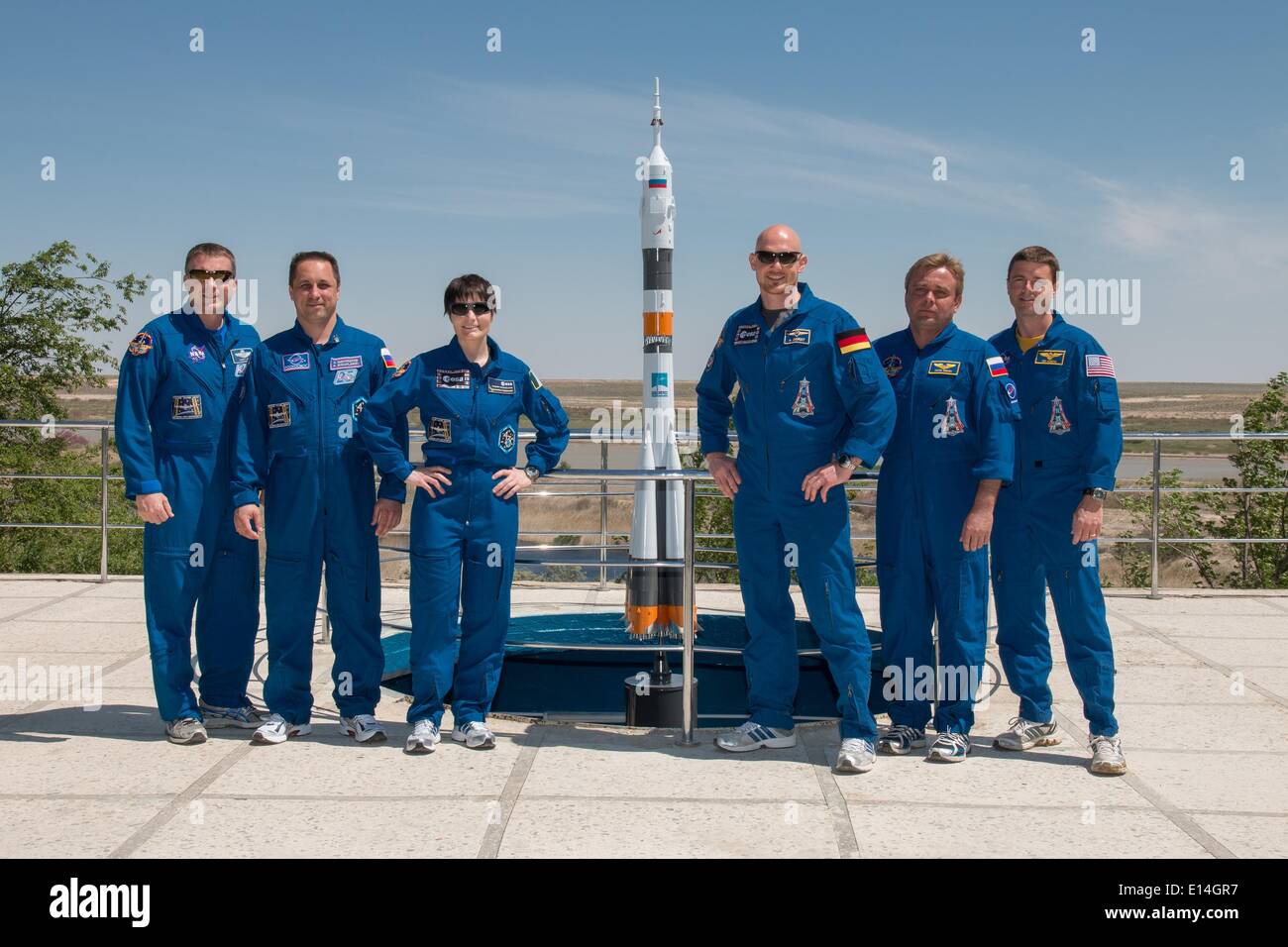 ISS Expedition 41 backup and prime crews pose for photos as part of their traditional pre-launch training ceremonies May 21, 2014 in Baikonur, Kazakhstan. From left to right are backup crew members Terry Virts of NASA, Anton Shkaplerov of the Russian Federal Space Agency and Flight Engineer Samantha Cristoforetti of the European Space Agency and prime crew members Alexander Gerst of the European Space Agency , Soyuz Commander Max Suraev of Roscosmos and Flight Engineer Reid Wiseman of NASA. The crew will launch on May 29 in the Soyuz TMA-13M spacecraft from Baikonur for a 5 ½ month mission on Stock Photo