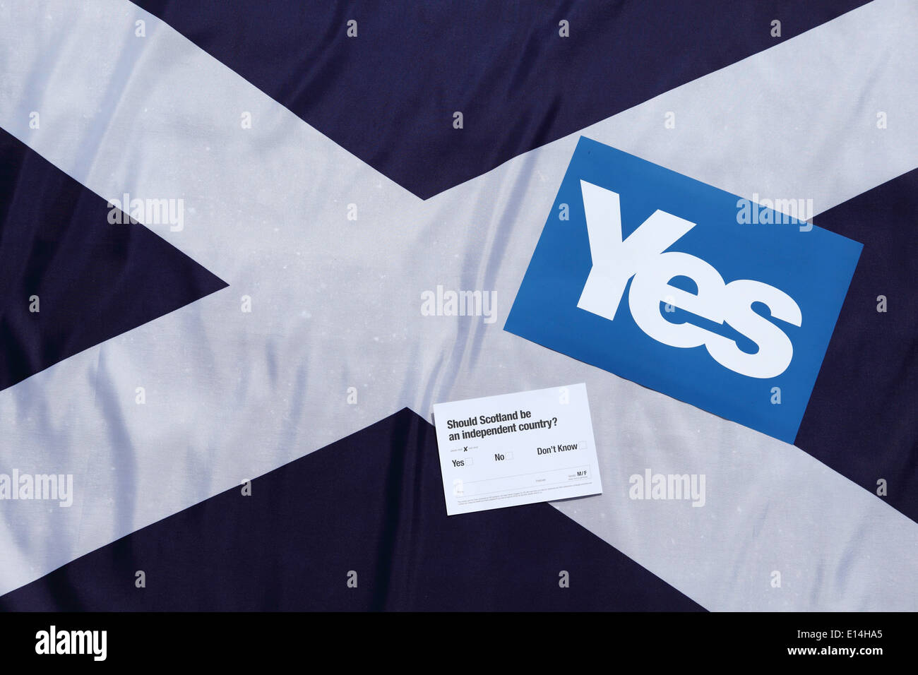 A Scottish Saltire flag with a yes sign and a flyer. Stock Photo