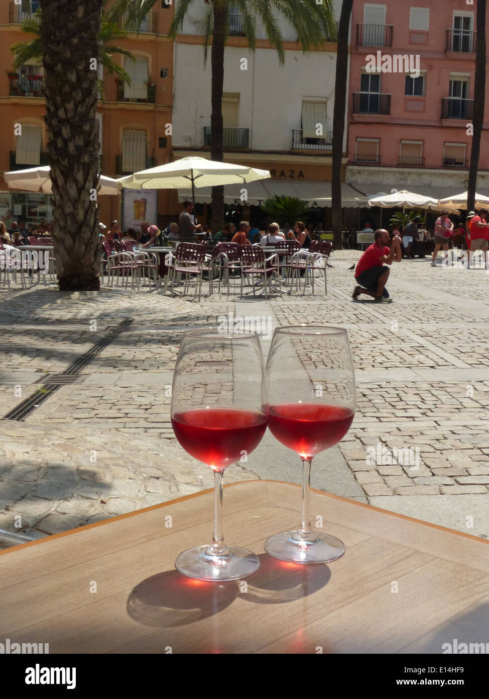 Two glasses of rose wine on a table in Cadiz main square Stock Photo