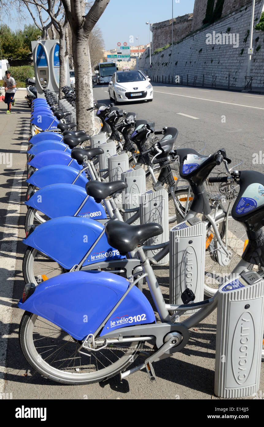 Row of Communal Bicycles or Bikes for Hire Docked on Bike Racks Marseille France Stock Photo