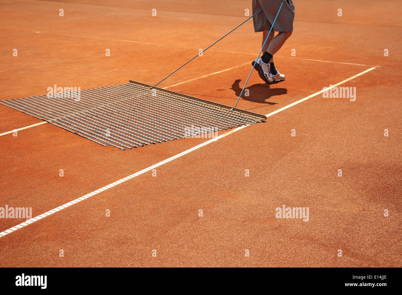 Aligning surface tennis court, with pulling network Stock Photo