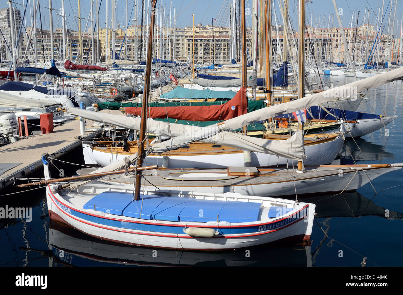 Traditional Wooden Yachts & Small Fishing Boat known as a Barquette Marseillaise Old Port Marseille or Marseilles France Stock Photo