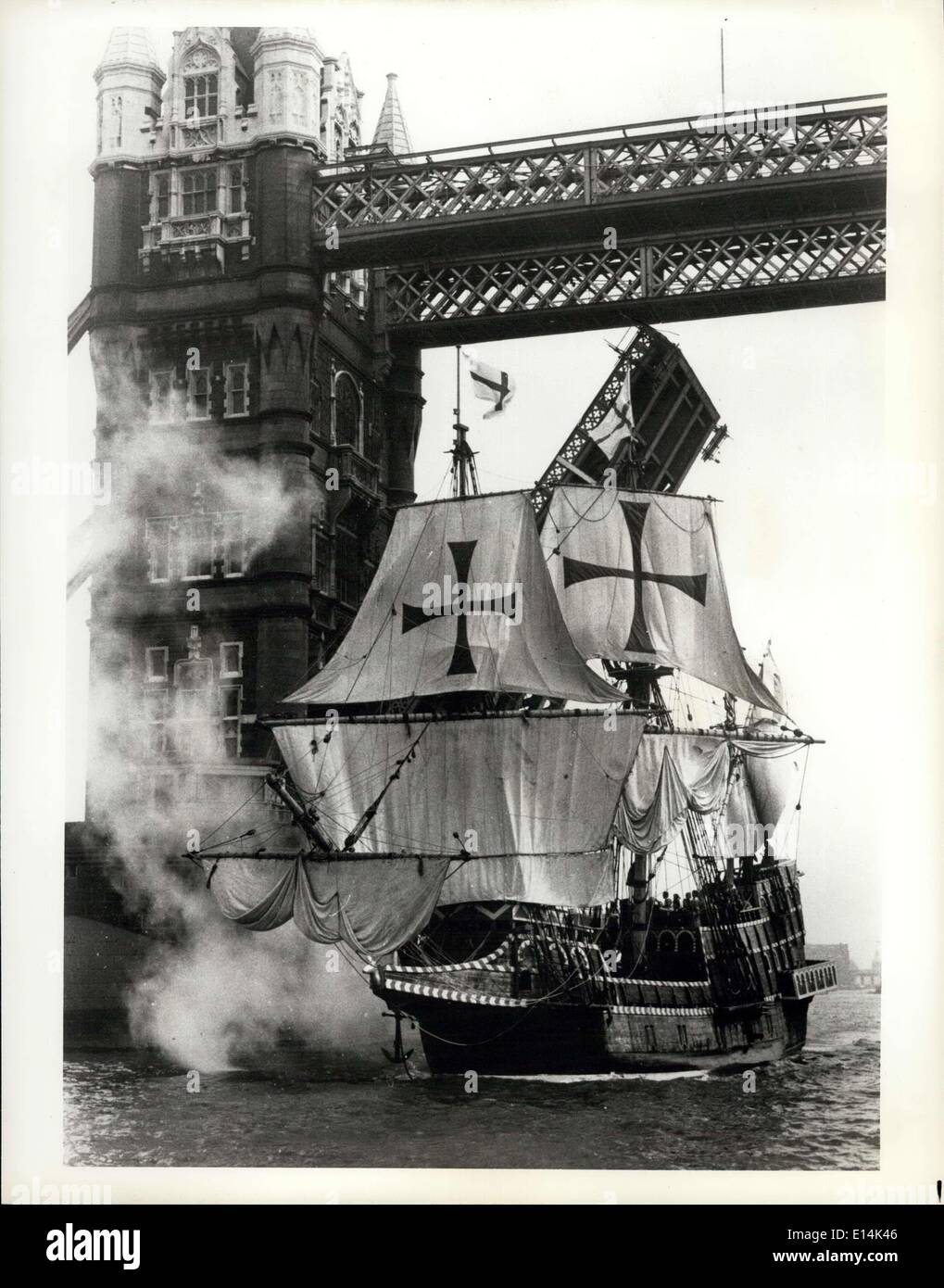 Apr. 05, 2012 - The Golden Hinde, modern replica of Sir Francis Drake's famous ship fires a salute from her cannon as she passes London's Tower Bridge. Stock Photo