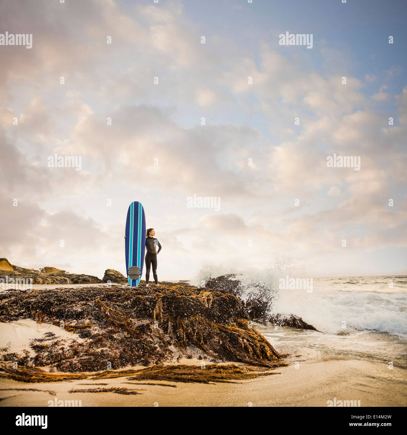 Surfer holding on to board hi-res stock photography and images - Alamy