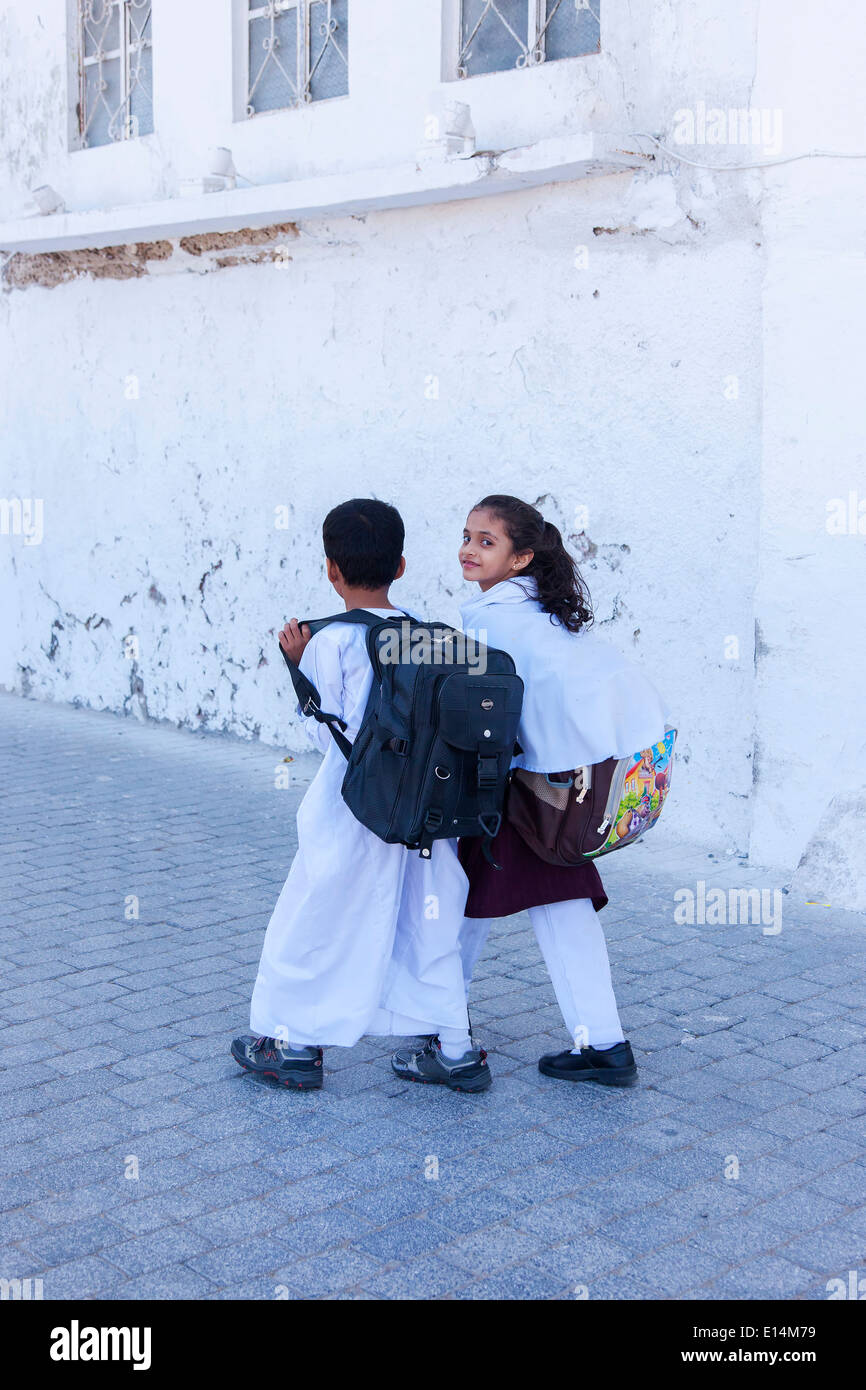 Children on the way home from School. Muscat, Oman Stock Photo