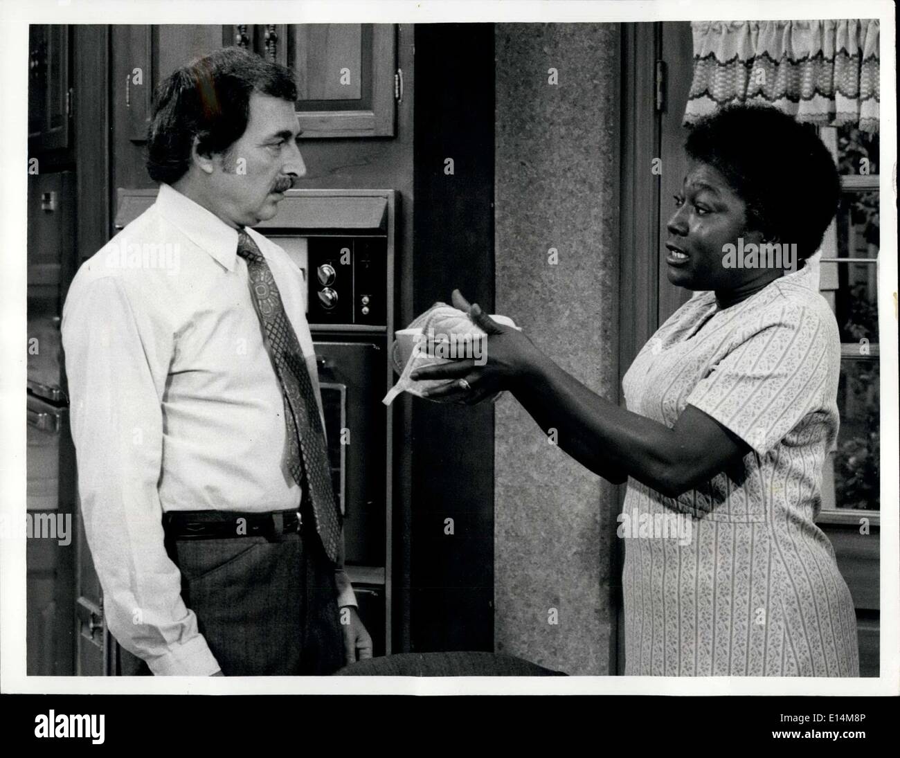 Apr. 05, 2012 - Bill Macy, starring as Walter Findlay, is not enthusiastic about getting dinner from Esther Rolle, as housekeeper Florida Evans, when Maude's new job selling real estate keeps her out at night, on ''Maude,'' Tuesday, April 2 (8:00-8:30 PM, EDT) on the CBS Television Network. (Re-broadcast) Stock Photo