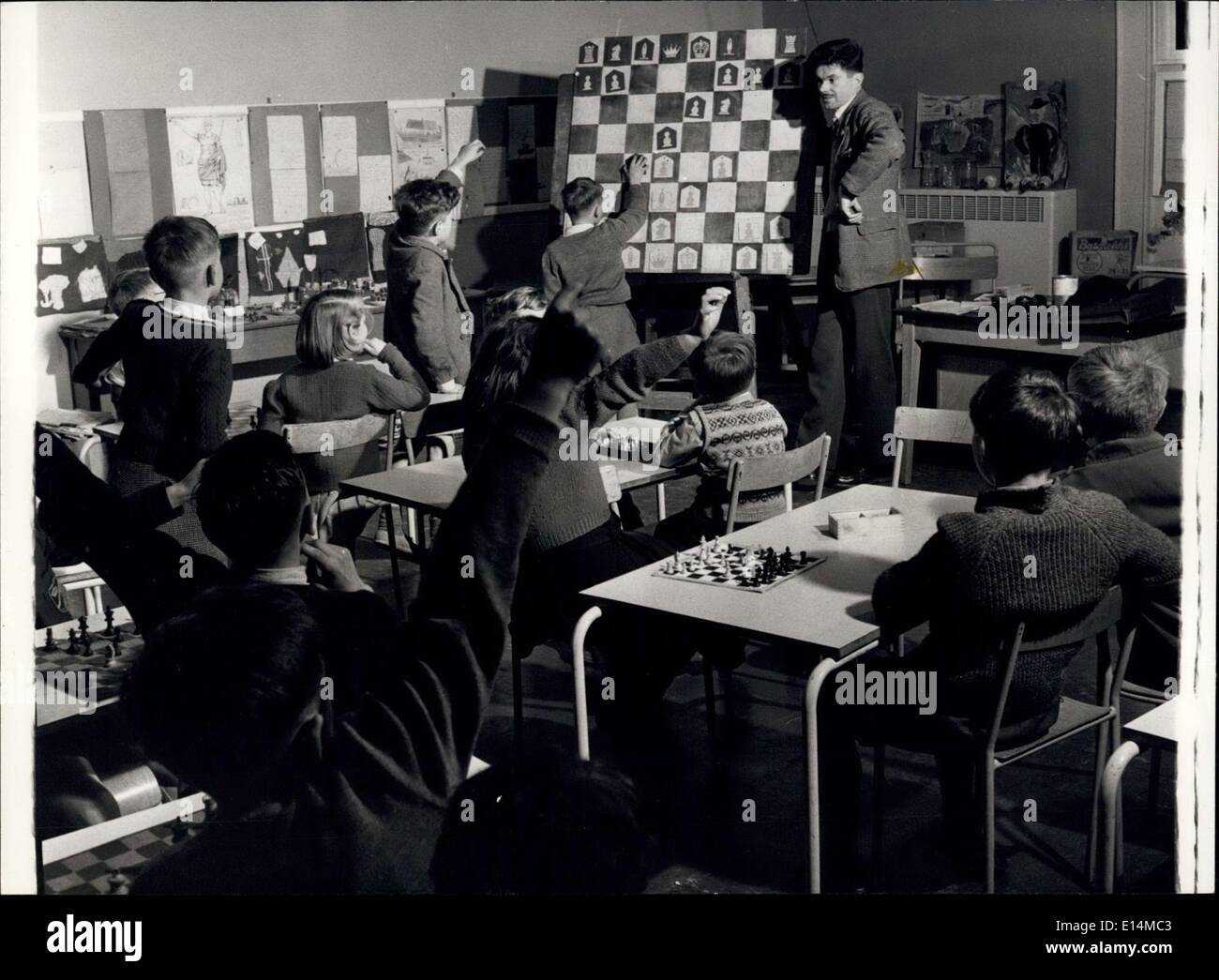 Apr. 05, 2012 - Chess For School Children: A Class In Progress: A chess class at the Langbourne Primary School, with the teacher, Mr. Ray Bott, demonstrating a good move using a blackboard chessboard, and child participation. Stock Photo