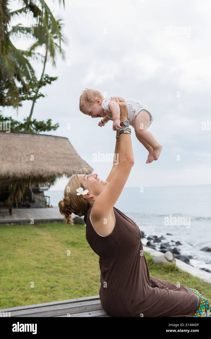 Caucasian mother and baby playing outdoors Stock Photo