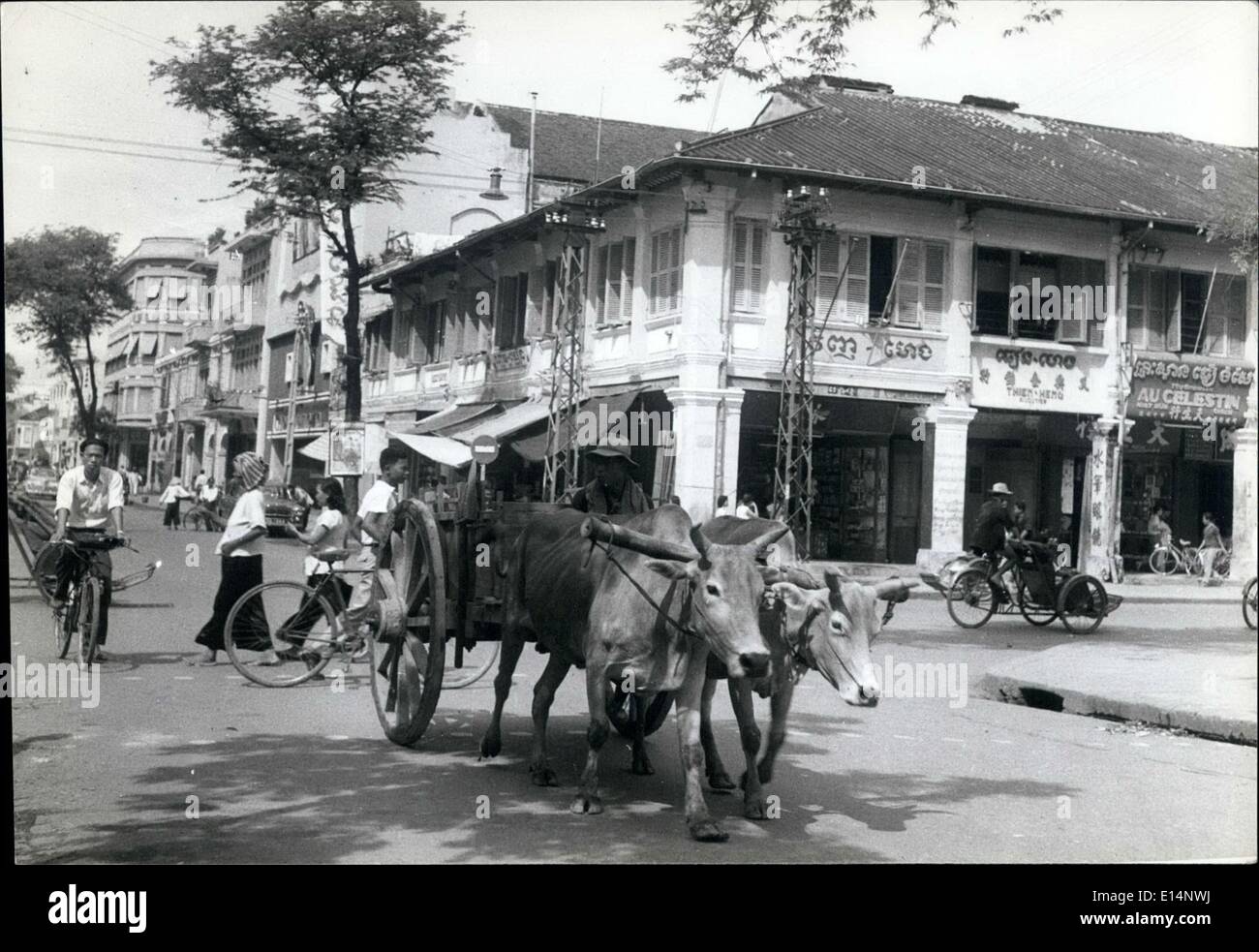 Apr. 18, 2012 - Series 2 (S.E.Asia) Cambodia: Although Phnom Penh can be classified as a modern city, old native customs prevail, and ancient means of transport mixes with the modern vehicles. This Cambodian farmer with his ox wagon is not uncommon in Phnom Penh. Stock Photo