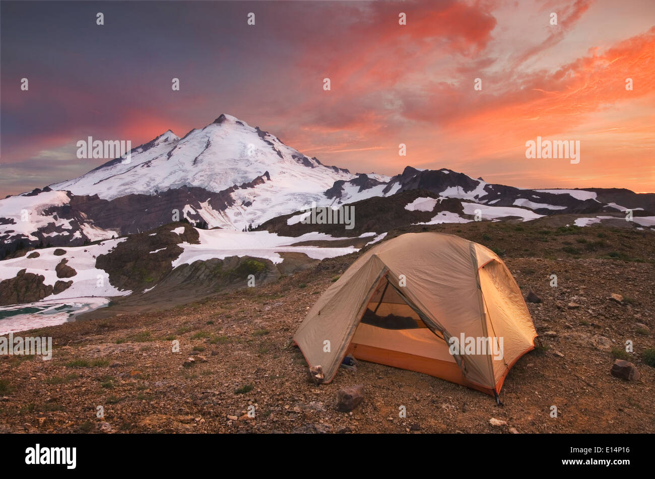 Tent at campsite in snowy mountain landscape Stock Photo