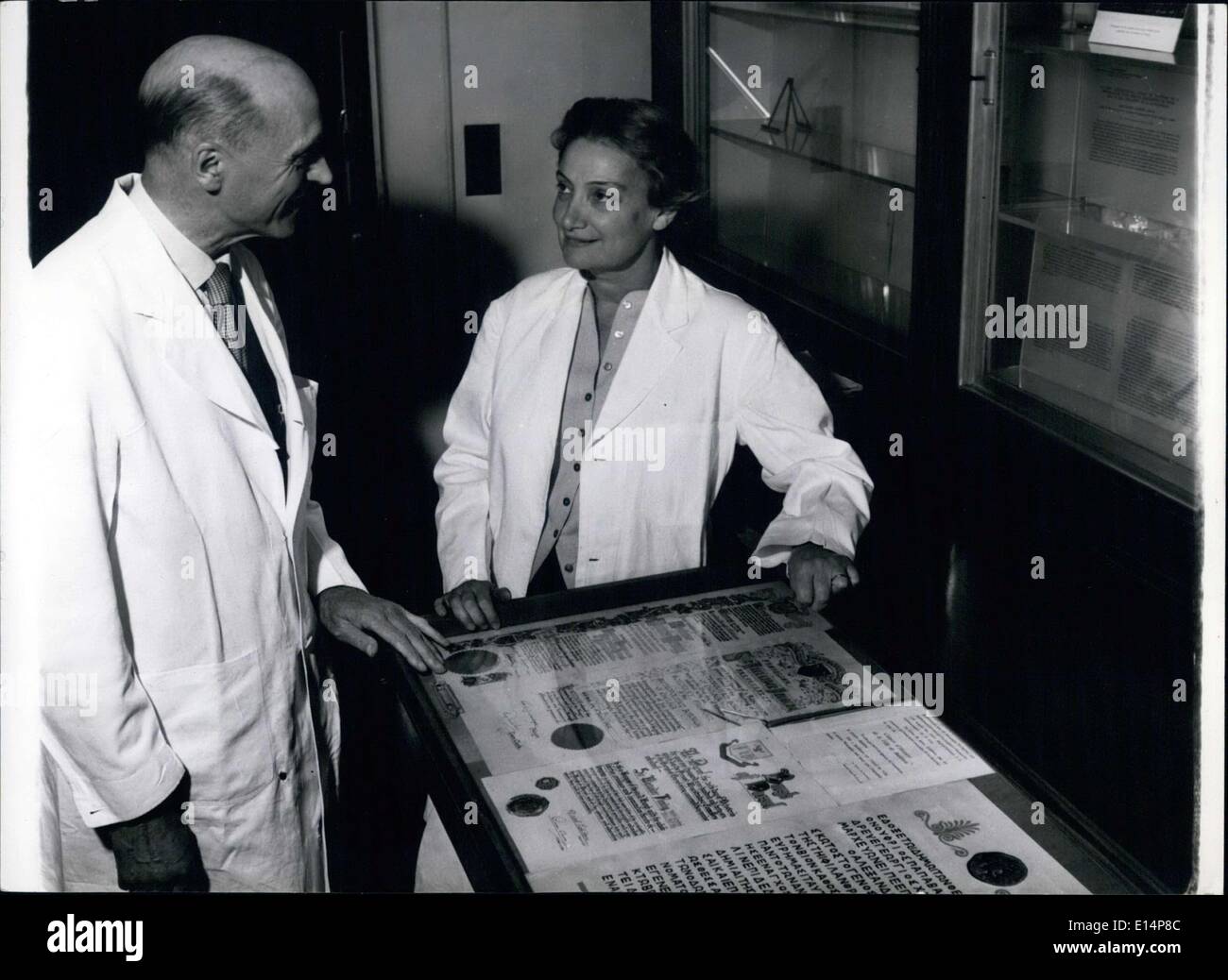 Apr. 12, 2012 - Lady Fleming shows Professor C.Pannett, Professor of Surgery, some of her late husband's City Freedoms and other honours, which are kept in cabinets at the museum she is building up his memory. Stock Photo