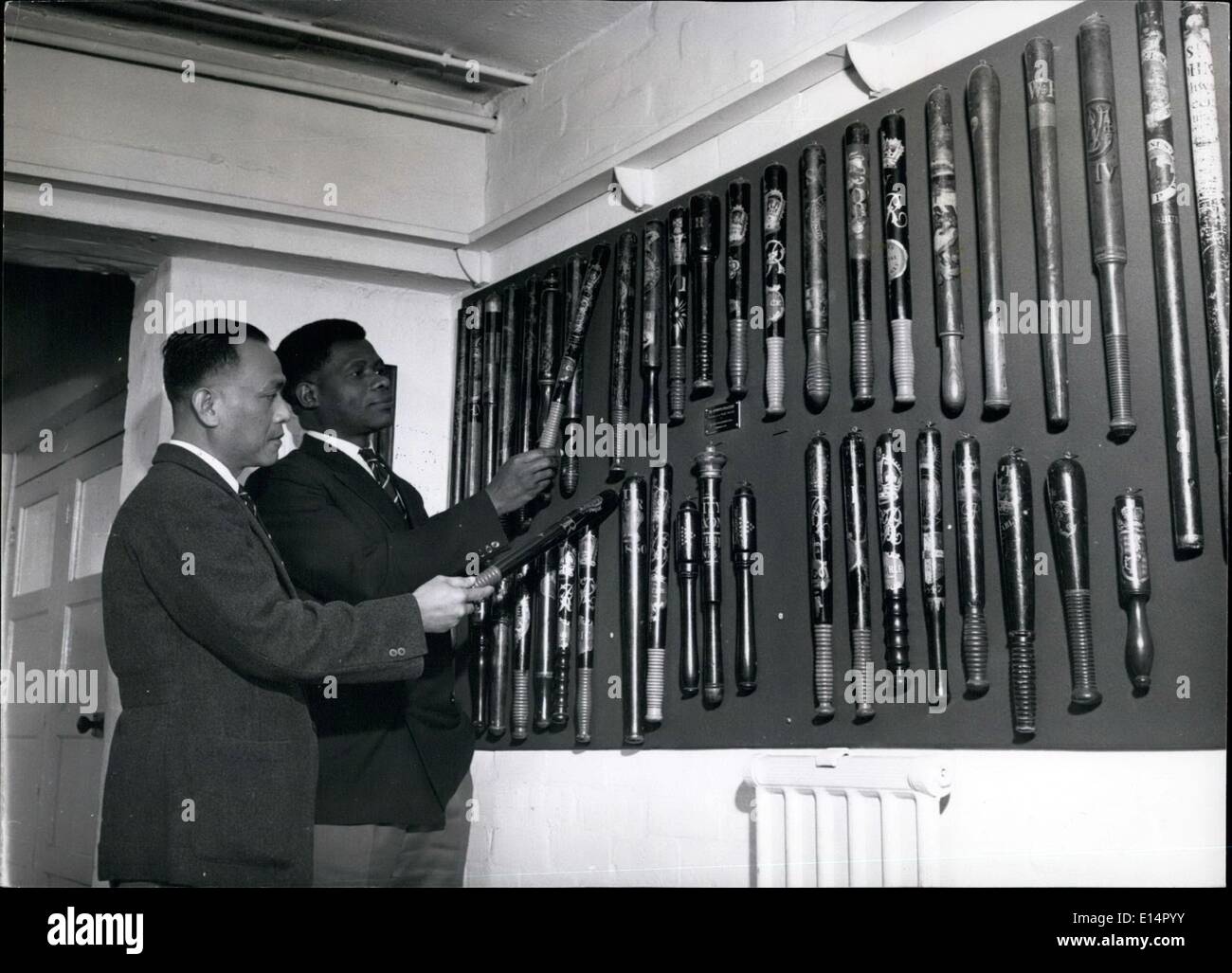 Apr. 18, 2012 - Chief Inspector Michael John of Sarawak (lef ) and Asst. Spt. Michael Henry tune of Nigeria examining a  interesting collection of truncheons in the Lounge. Stock Photo
