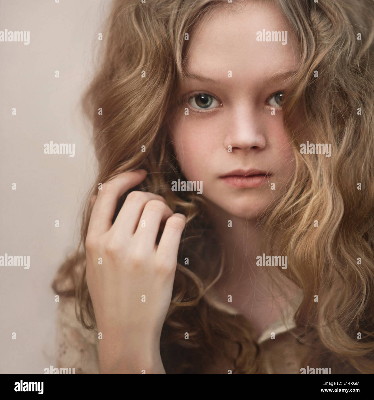 Caucasian girl playing with her hair Stock Photo