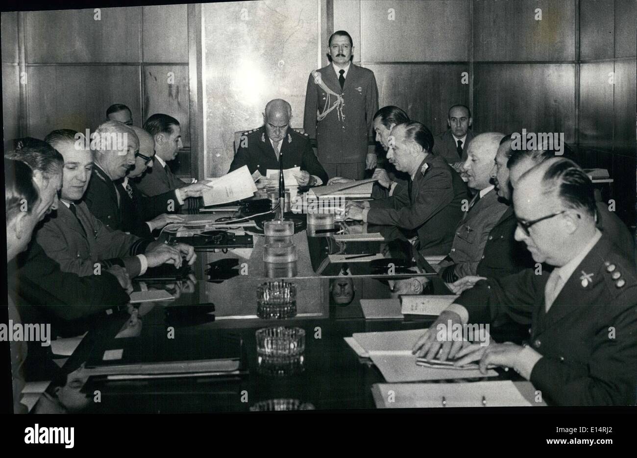 Apr. 18, 2012 - Argentina's President gathers with his Command: The Argentine Military government headed by President Agustin Lanusse (seated in background) in one of his continuous meeting with the Commanders of the Army (left, center with moustache. General Lopez Anfranc the Aviation (just at right of Lamusse) General REy and the Navy, (at his Lanusses left) rear admiral Coda. Repeatedly President Lanusse informes the Nation that the armed forces will accept any result of the next presidential election take place on march 11th 1973 Stock Photo