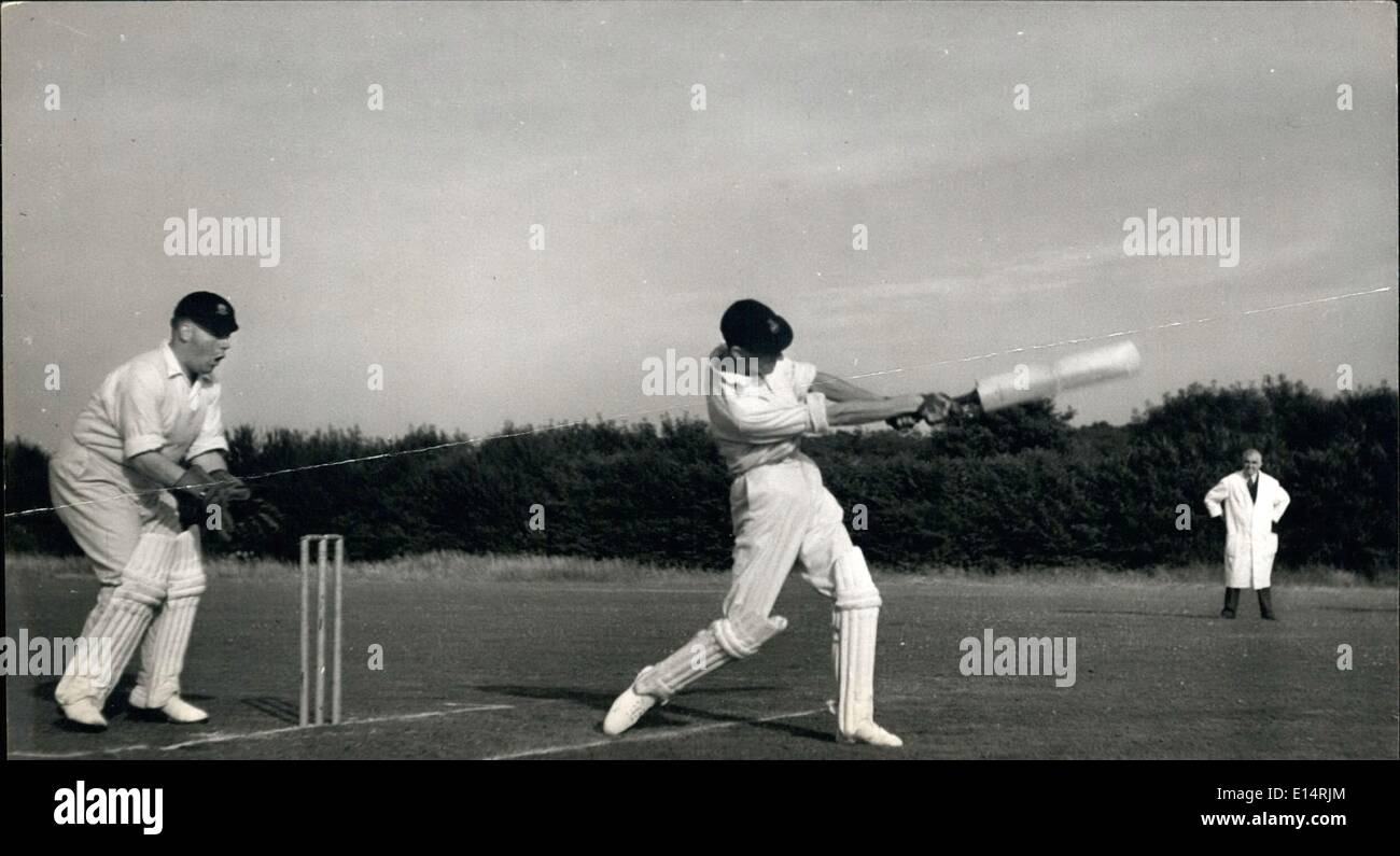 Apr. 18, 2012 - Ambledon - Home of Cricket.: Hambledon batsman, Lieut. Evans hits out for the boundary. The wocket keeper looks Stock Photo