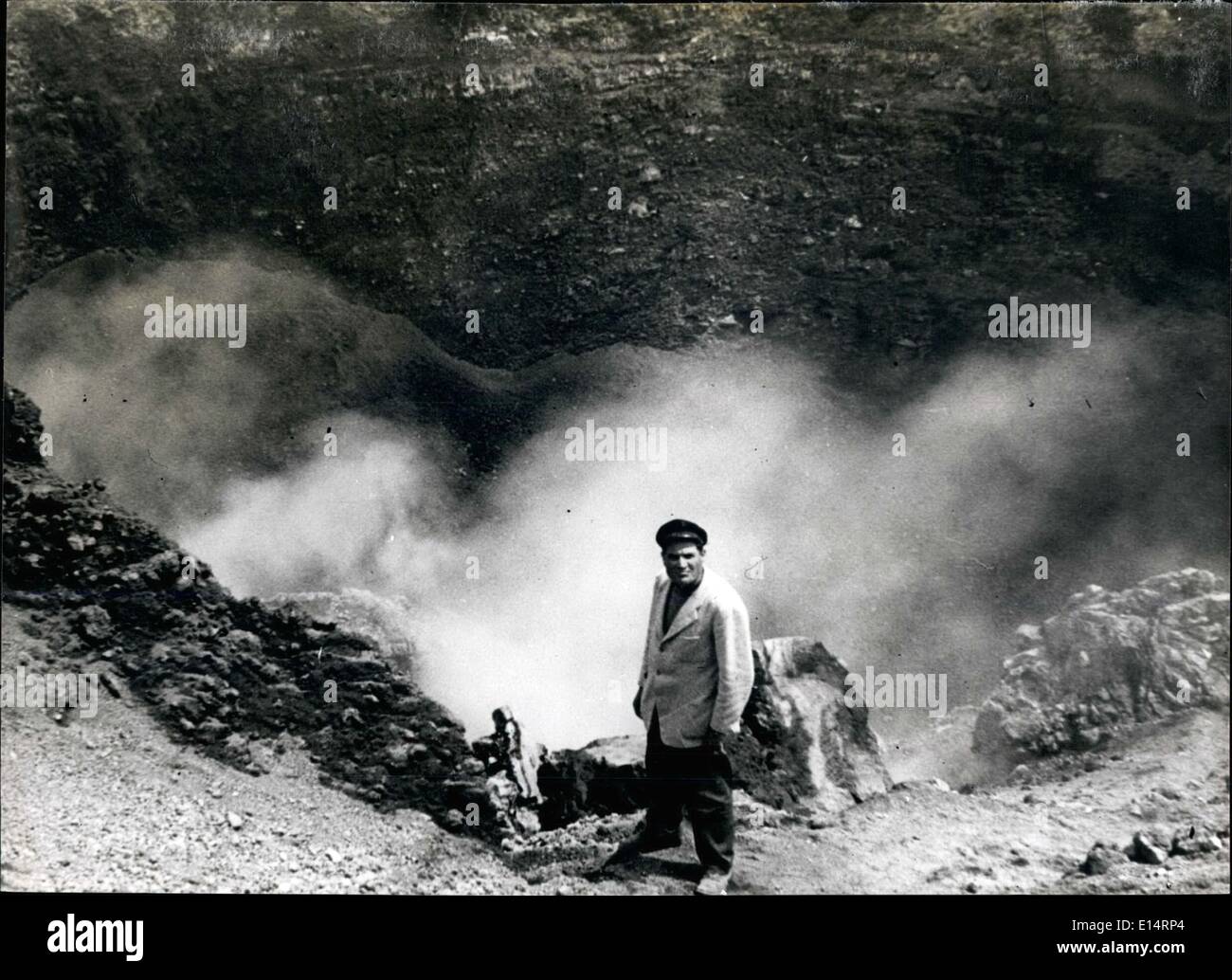 Apr. 18, 2012 - One of the most vivid Scenes Shown during the broadcast Showing a commentator who has climbed out of the Smoking Crater of Vesuvius. Steam escapes from the fissures in side of the Crater,indicating the extreme heat beneath the surface of the earth. To show the heat an egg was fried on the ground. Stock Photo