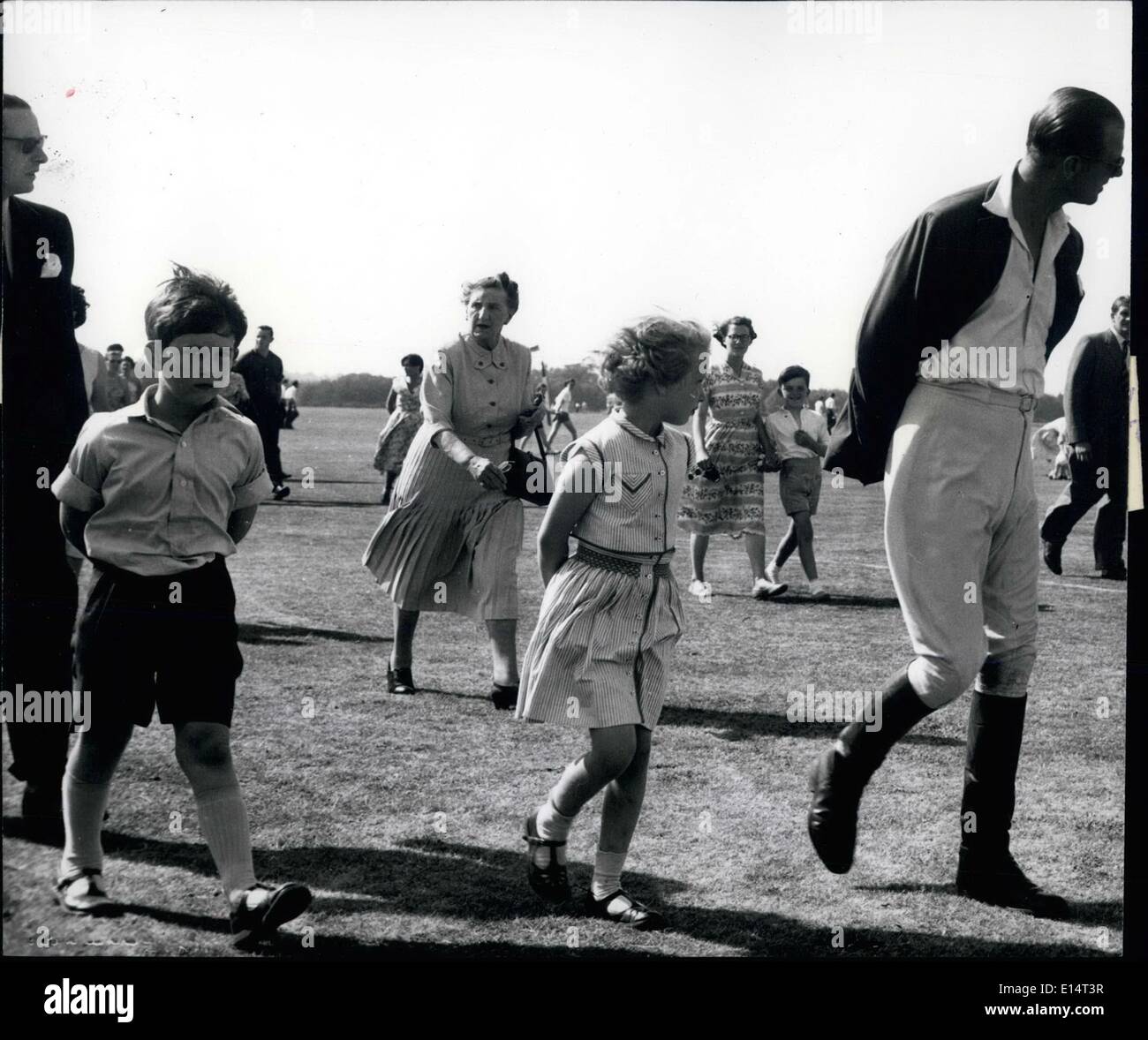 Apr. 18, 2012 - All three: Prince Philip, Princess Anne and Prince Charles all three with their hands behind their backs., pictured at a polo match at Windsor in June, 1957. Stock Photo