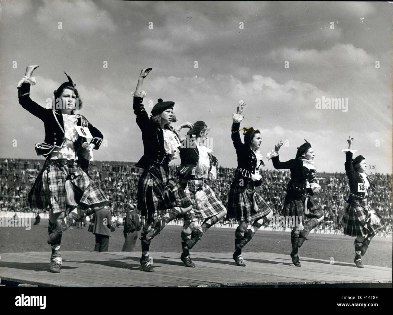 Apr. 18, 2012 - The World Dances: The Highland's of Scotland: To the skirl of the pipes, pretty Scottish sies perform the traditional reels and dances of Scotland. ey wear ceremonial dress, black velvet jacket, lace ffles and the tartan ilt of the clan to which they belong. Stock Photo