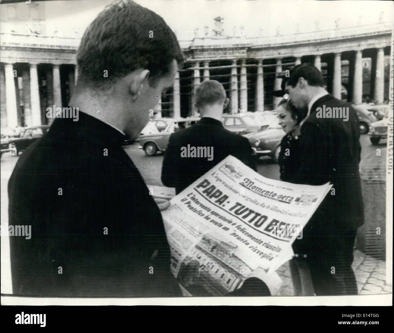 Apr. 18, 2012 - Operation on The Pope Success Scenes In St. Peter's Square; Pope Paul today underwent an operation for the removal of an elarged prostrate gland. An official said it had been a complete success. Photo shows A priest read a special edition of an Italian newspaper giving new of the Pope's operation. Stock Photo