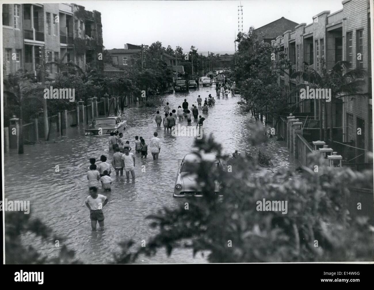Apr. 18, 2012 - Typhoon Amy floods Taipei: A flooded Taipei street with the inhabitants wading about near abandoned cars. Stock Photo