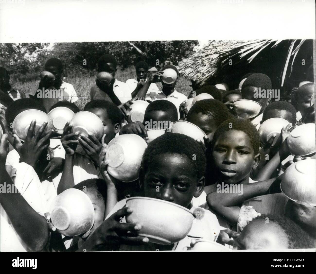 Apr. 18, 2012 - Feeding Kenya's students in Mombasa: The British organisation Oxfam, has just started a new feeding scheme for the Kenya schoolchildren. The food, bowls, cooking pots, measuring jugs, ladies and administration costs are paid by Oxfam.The food provided is intended to be a basis of diet, not sufficient in itself. But sometimes it takes a bit of explanation to parents that this is the intention and that they must not expect a full meal for their children, sufficient for the wholedday Stock Photo