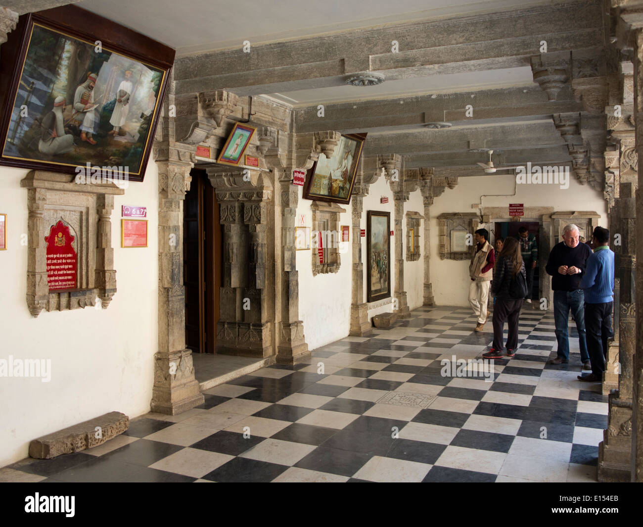 India, Rajasthan, Udaipur, City Palace museum tour, visitors in upper floor gallery Stock Photo