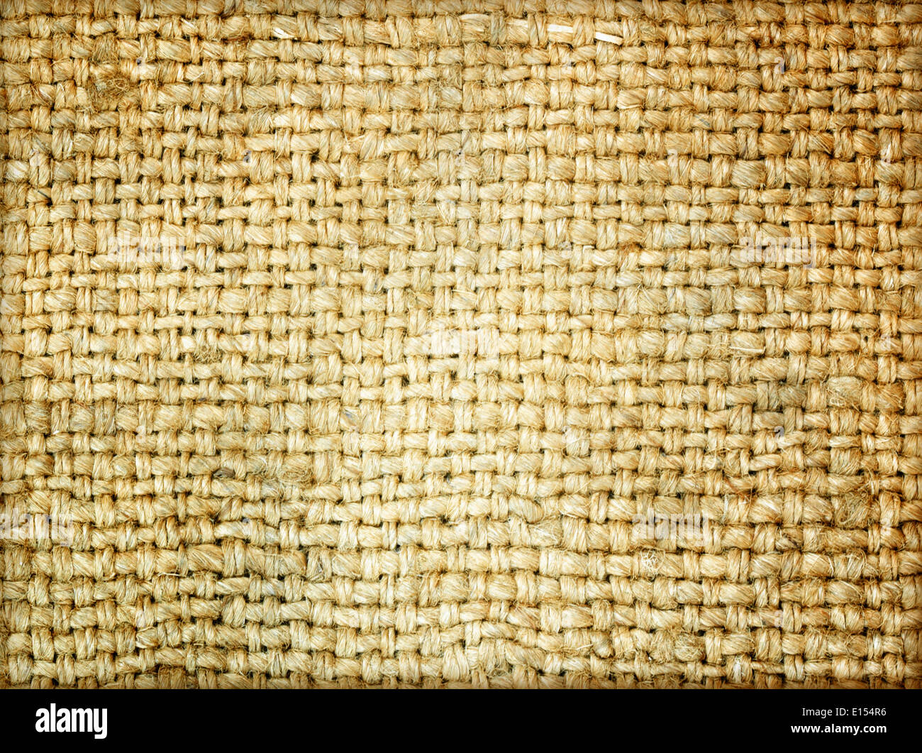 Square, rectangular long pieces of canvas, cut burlap fabric, patch for  clothes, dry garbage, scraps of fabric, background for text from fabric  isolated on a white background. Stock Photo