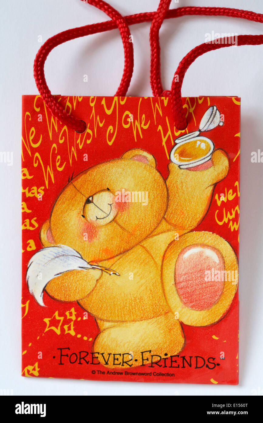 Forever Friends gift bag with Forever Friends teddy bear set on white background Stock Photo