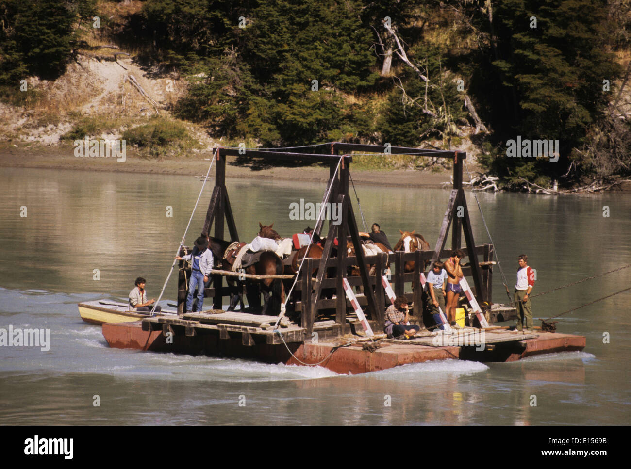 Horses and people on river ferry Puerto Rio Tranquilo in Chile South America Stock Photo