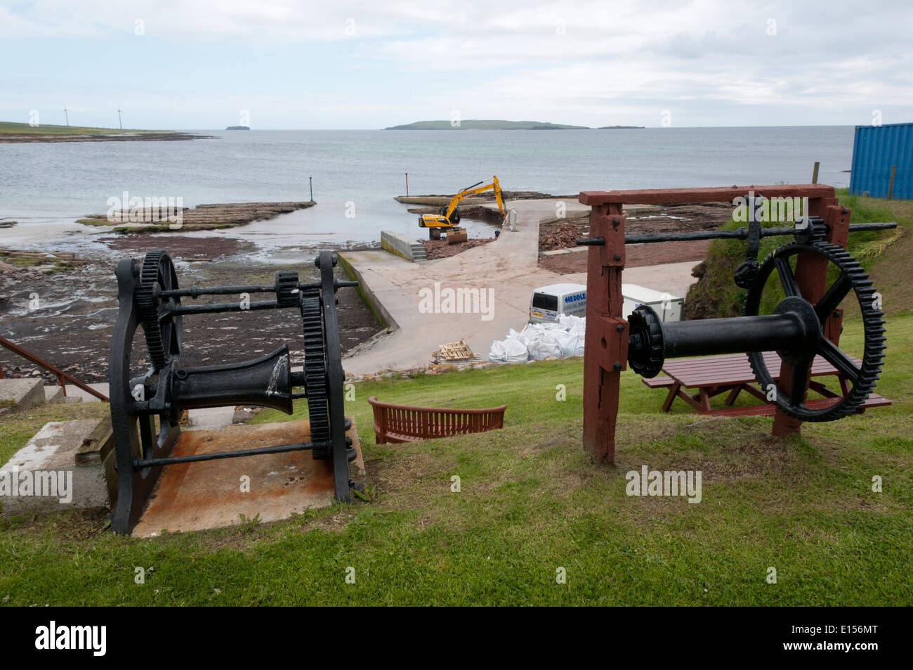 Two old boat winches behind the harbour of Newark Bay on Orkney Mainland. Stock Photo