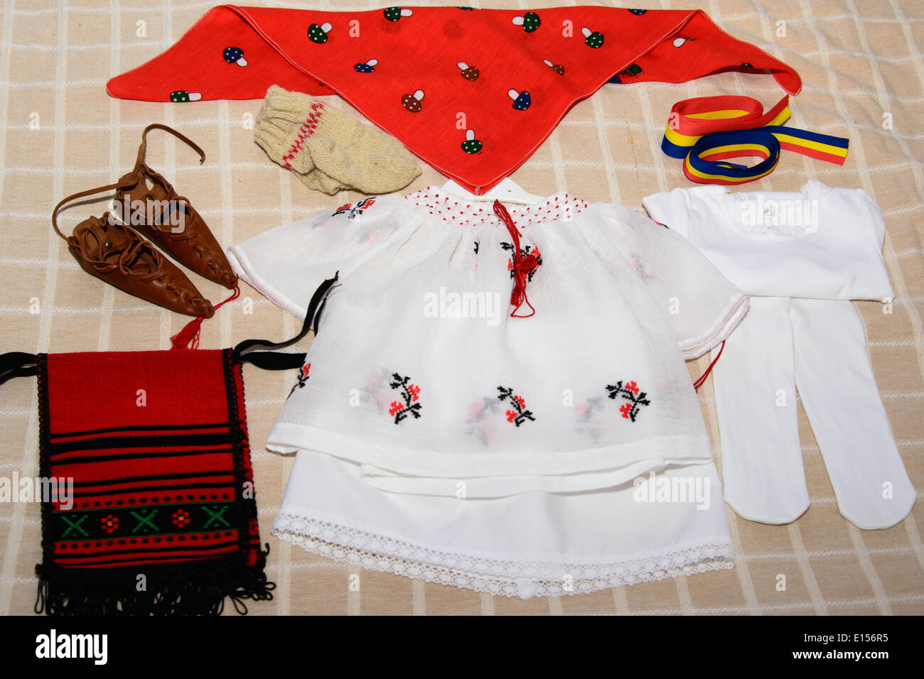 Traditional costume from Romania, ethnic symbol with romanian flag Stock Photo