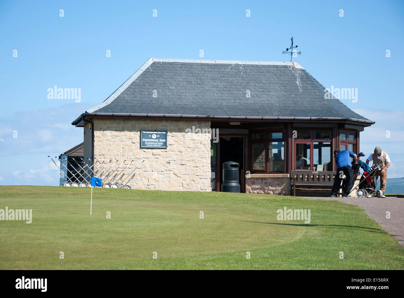Two Gentlemen Golfers Outside The Professionals Shop Machrihanish Golf Club Mull of Kintyre Stock Photo