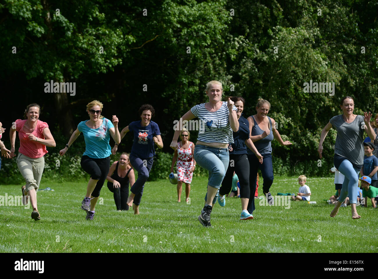 School sports day mothers parents and teachers race 2014 Stock Photo