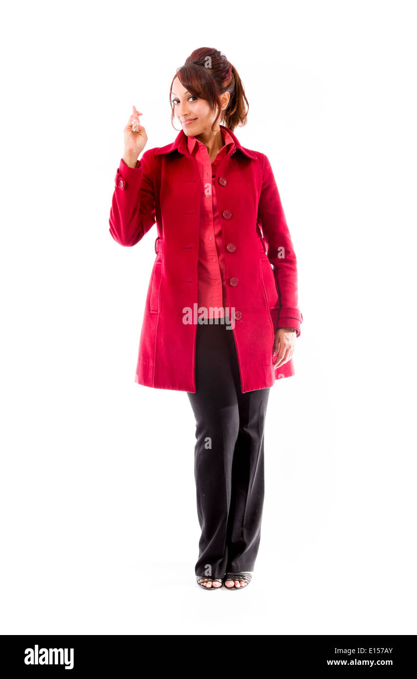 Indian young woman standing with finger crossed Stock Photo - Alamy