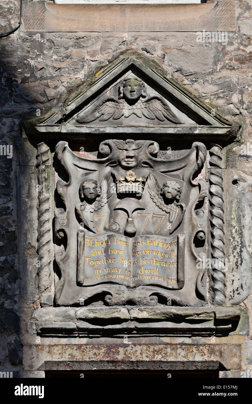 Carved stonework plaque above a doorway on the Royal Mile, Edinburgh Stock Photo
