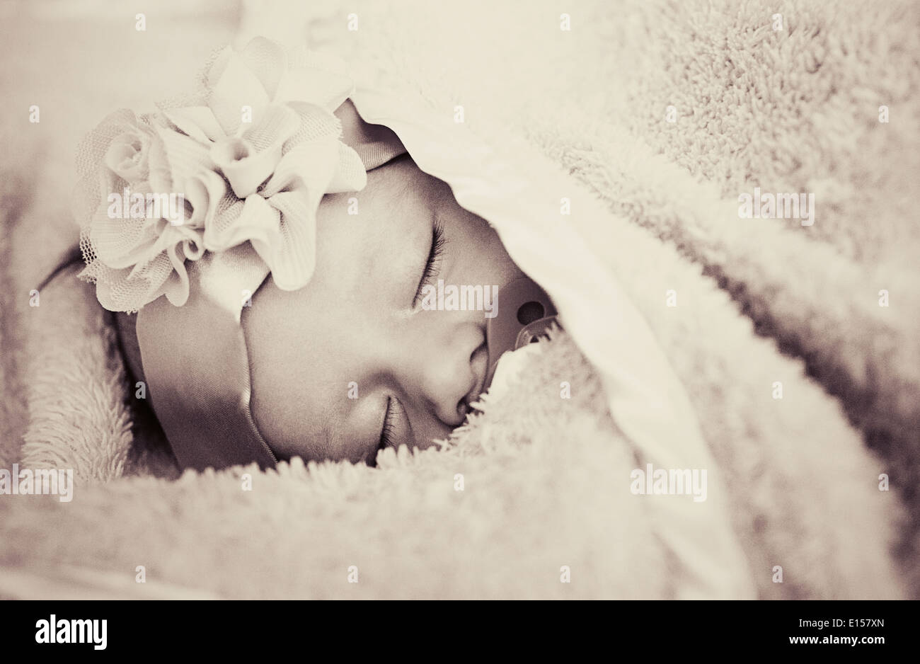 Close-up portrait of a beautiful sleeping baby-girl (with some grain) Stock Photo