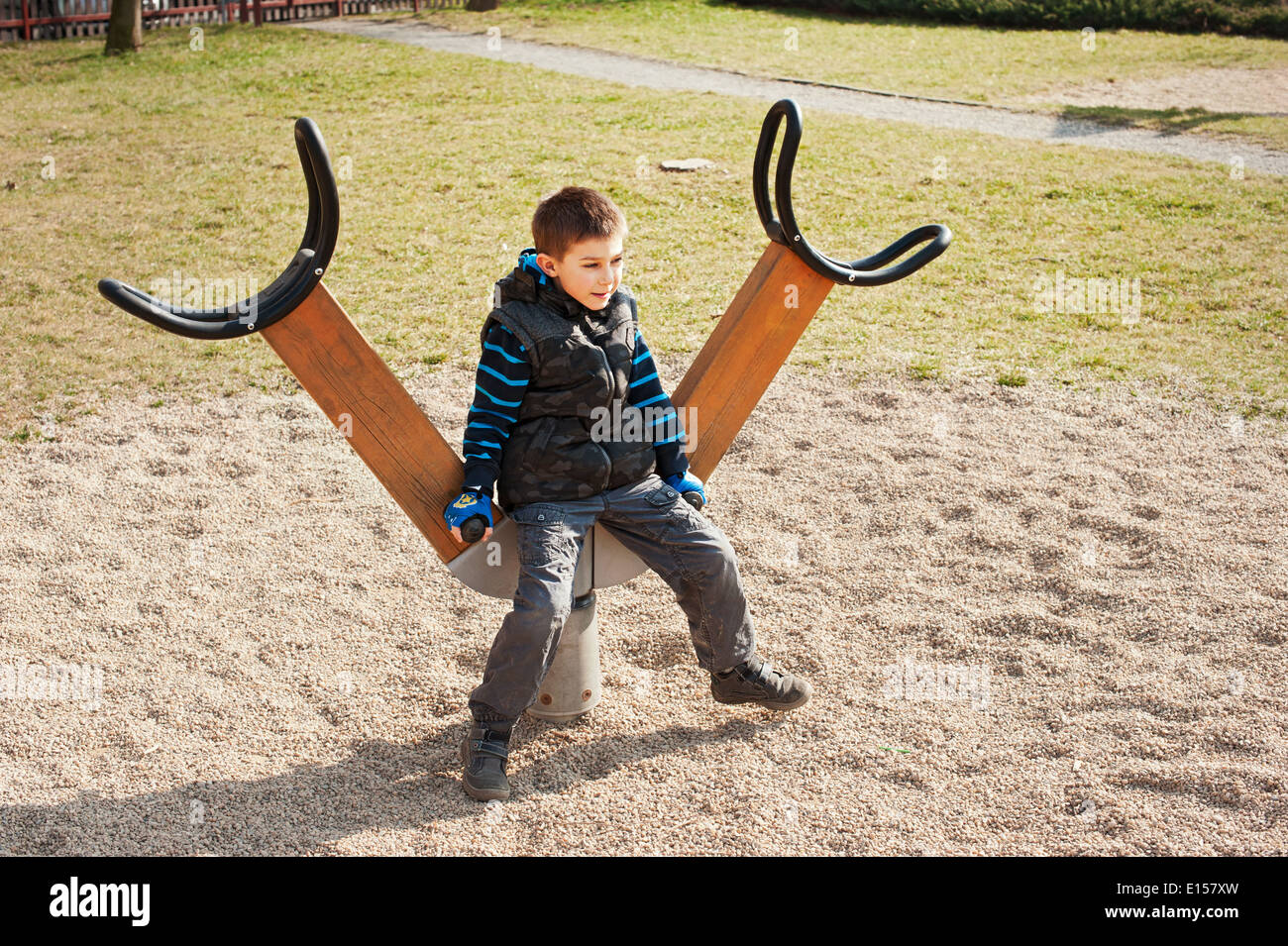 A boy playing in playground area Stock Photo
