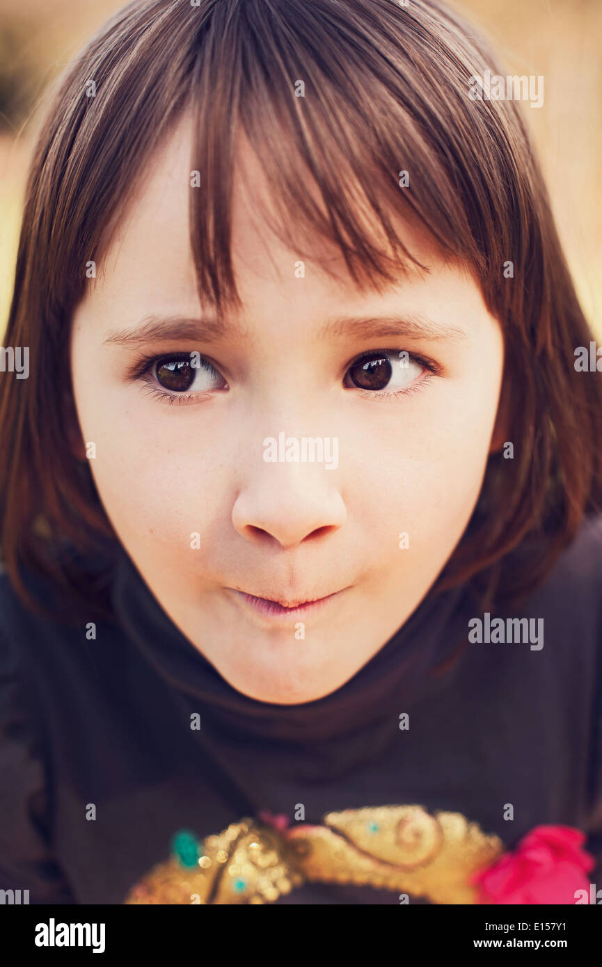Girl with funny facial expression Stock Photo