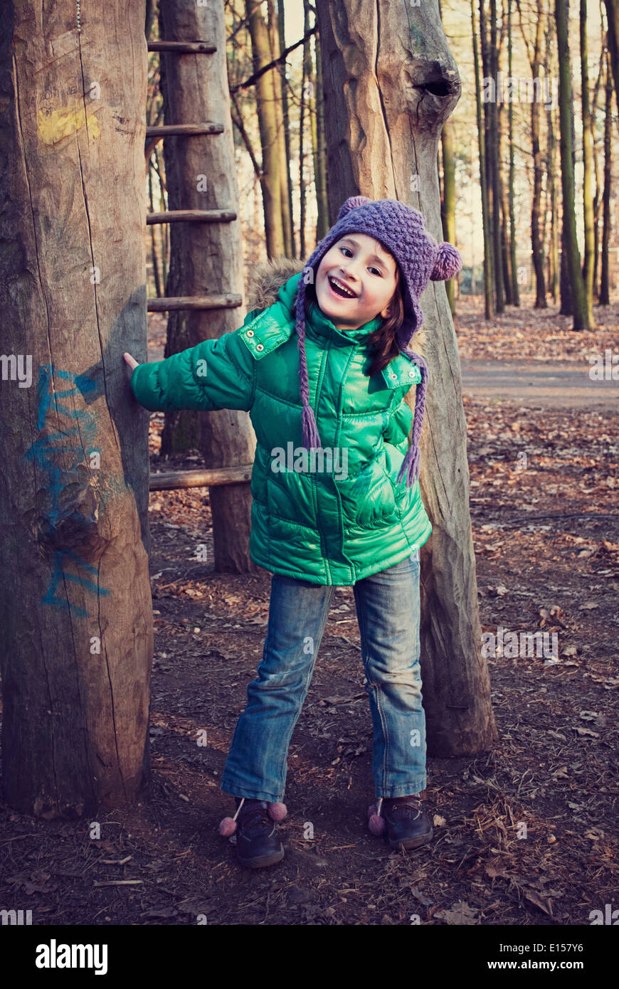 Beautiful girl playing in playground area Stock Photo