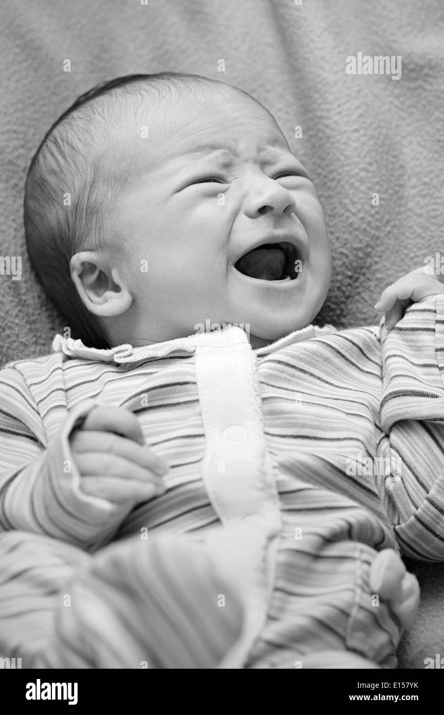 Portrait of newborn baby crying Stock Photo