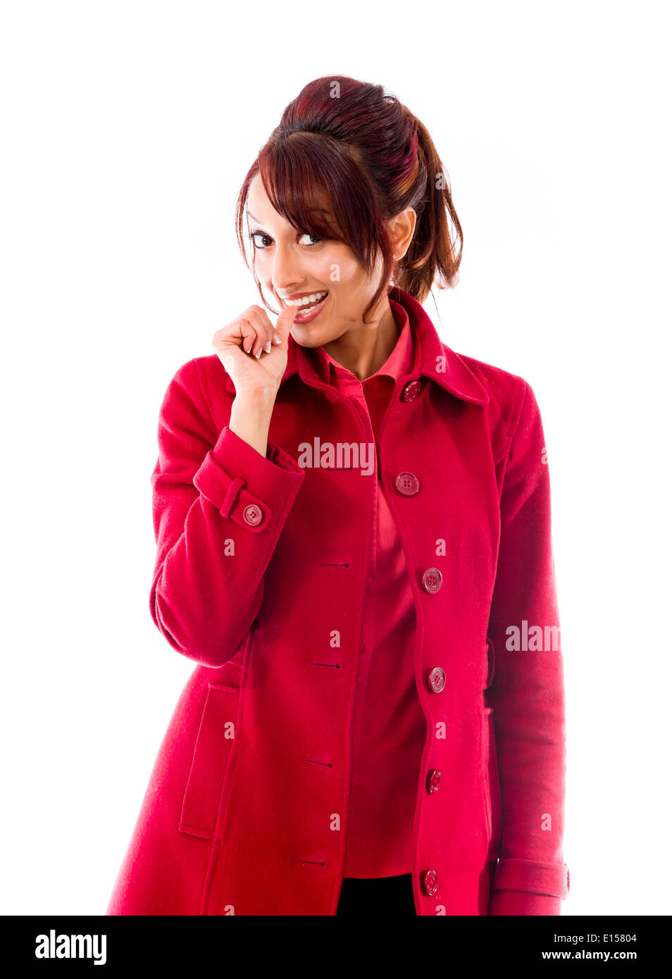 Indian young woman smiling with finger in mouth Stock Photo - Alamy