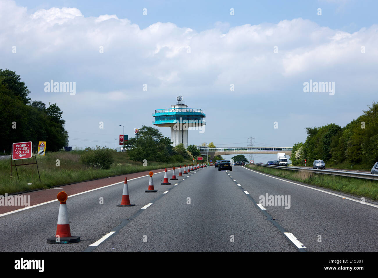 roadworks closed lane and pennine tower of lancaster forton services M6 motorway lancashire uk Stock Photo