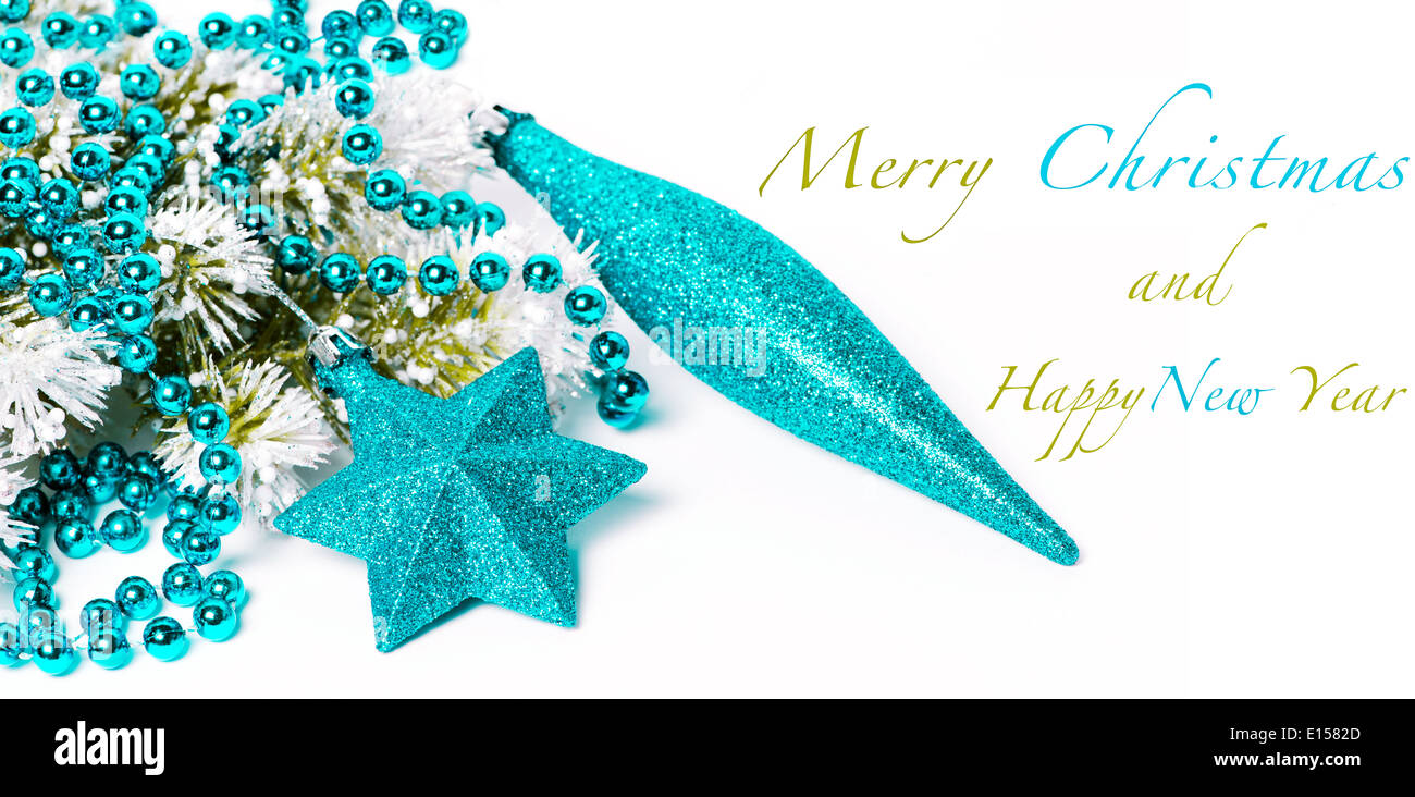 Blue Christmas decorations on snowy pine branch with sample text Stock Photo