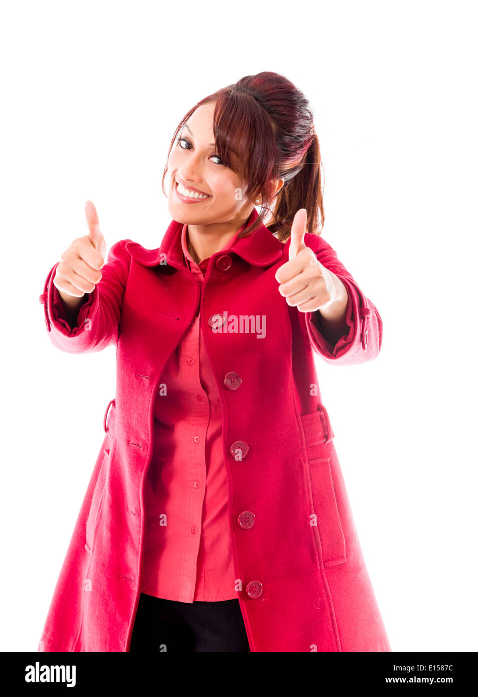 Smiling Indian young Woman showing thumb up sign isolated on white background Stock Photo