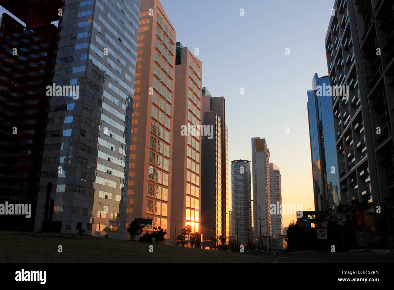 Sunrise among the tall modern skyscrapers in the business district of Santa Fe in Mexico City Stock Photo
