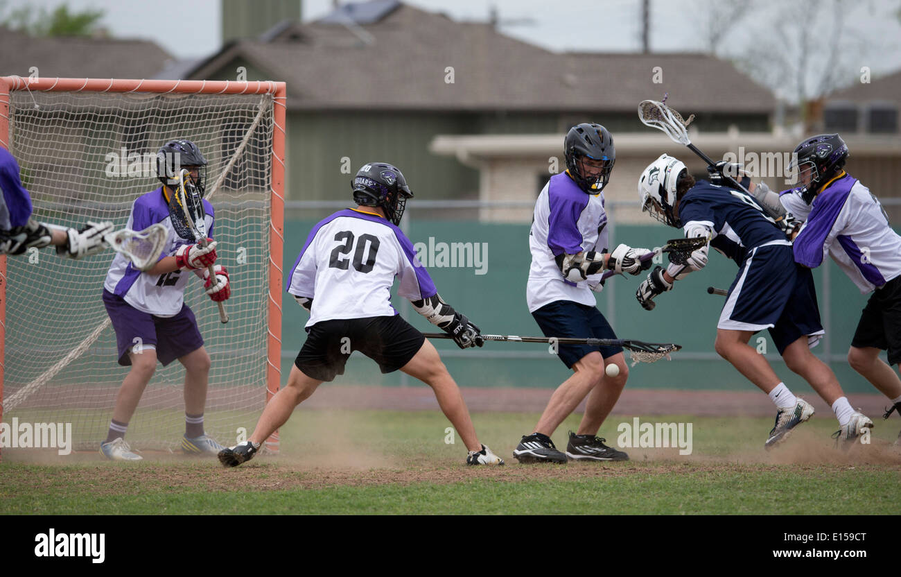 Texas high school boy's lacrosse action featuring LBJ High School